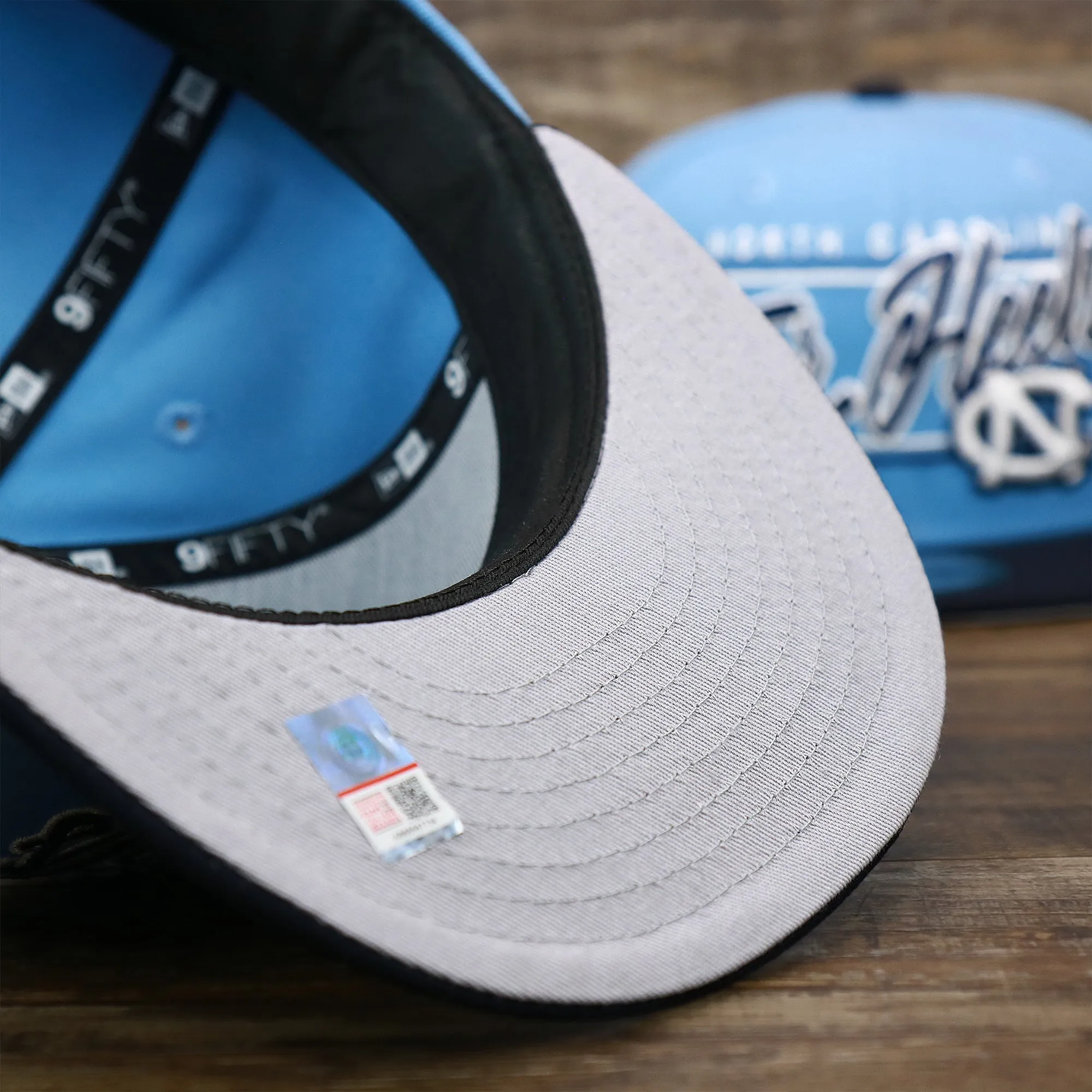 North Carolina Tar Heels Team Script Gray Bottom 9Fifty Snapback | Light Blue And Navy Blue Snap Cap