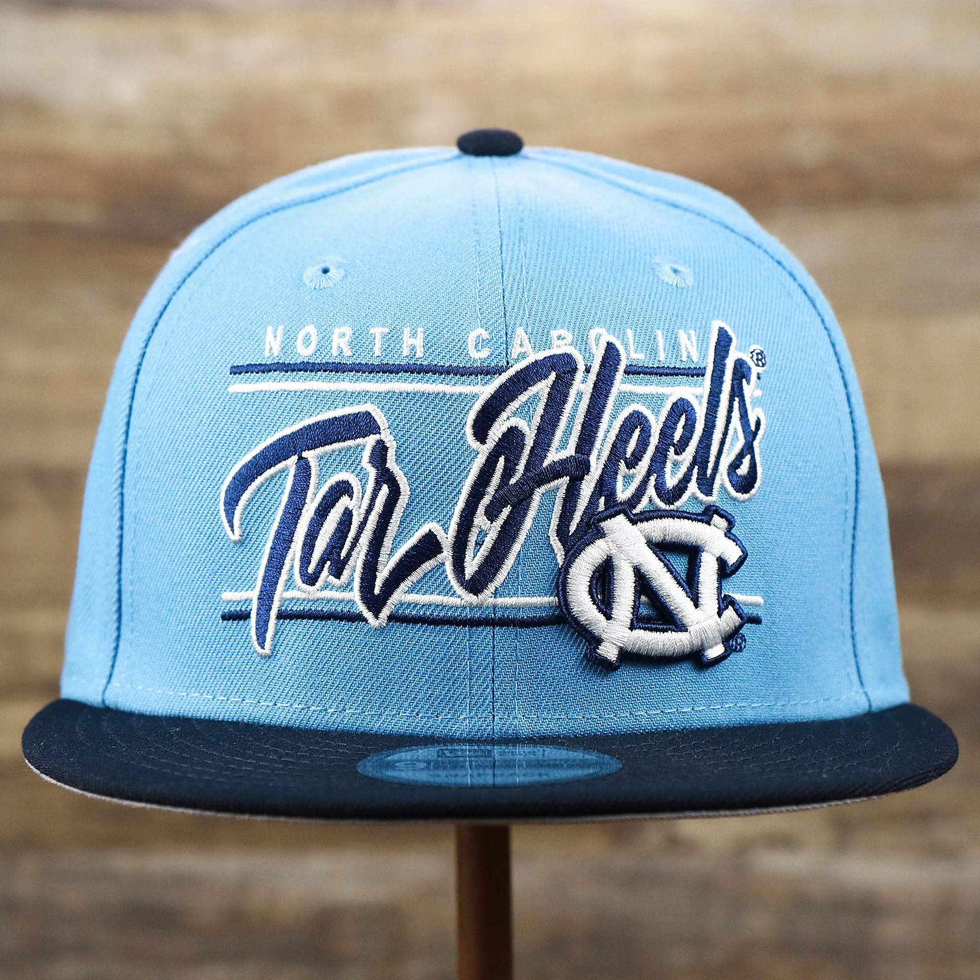 North Carolina Tar Heels Team Script Gray Bottom 9Fifty Snapback | Light Blue And Navy Blue Snap Cap